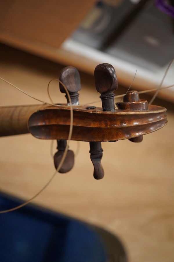 Two cased violins; one French 19th century bearing a hand written label for Francesco Werentle 1746, body length 35.5cm, the other an early 20th century violin, body length 35cm. Condition - poor.